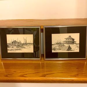 Pair of black and cream beach drawings. Matted in chrome frame with glass